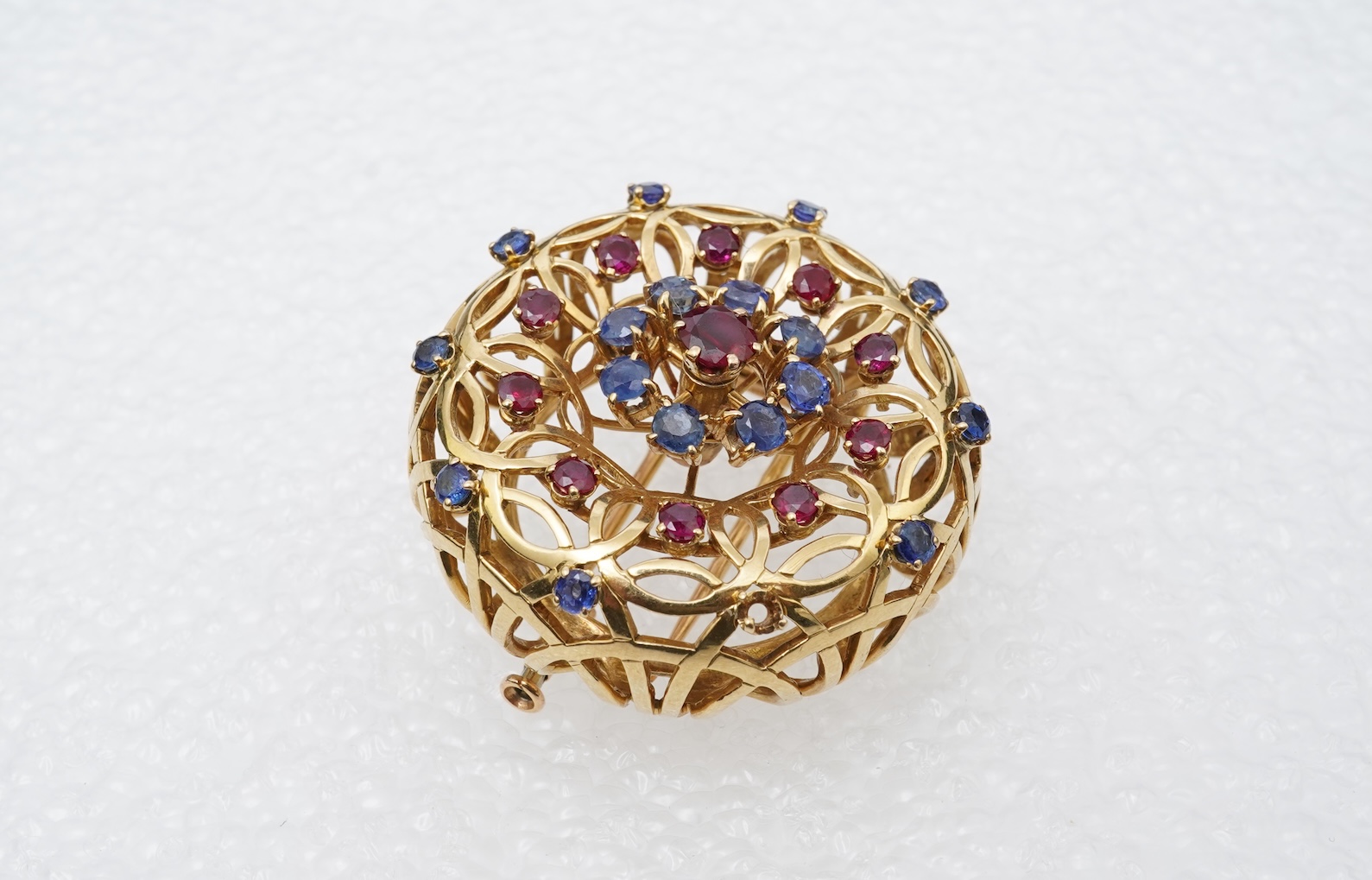 Mellerio dits Meller, a ruby and sapphire brooch, mid 20th century